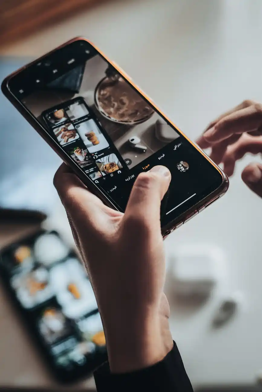 person taking a picture with their phone