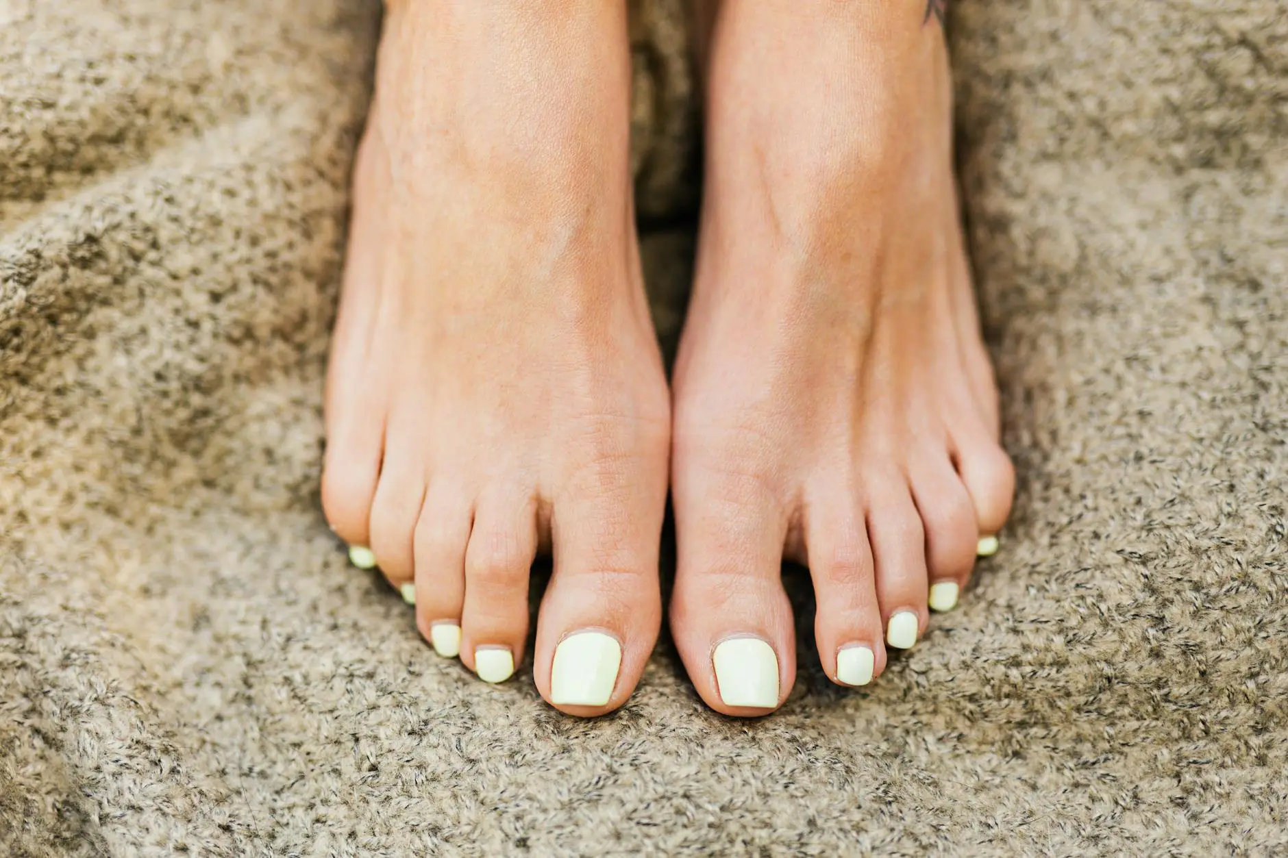 woman with painted toe nails
