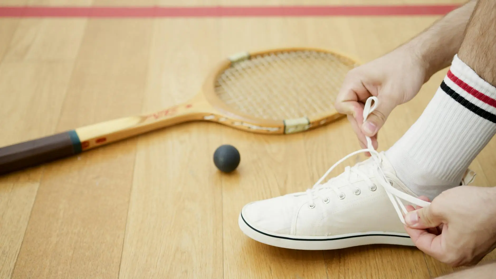 a person tying shoe lace