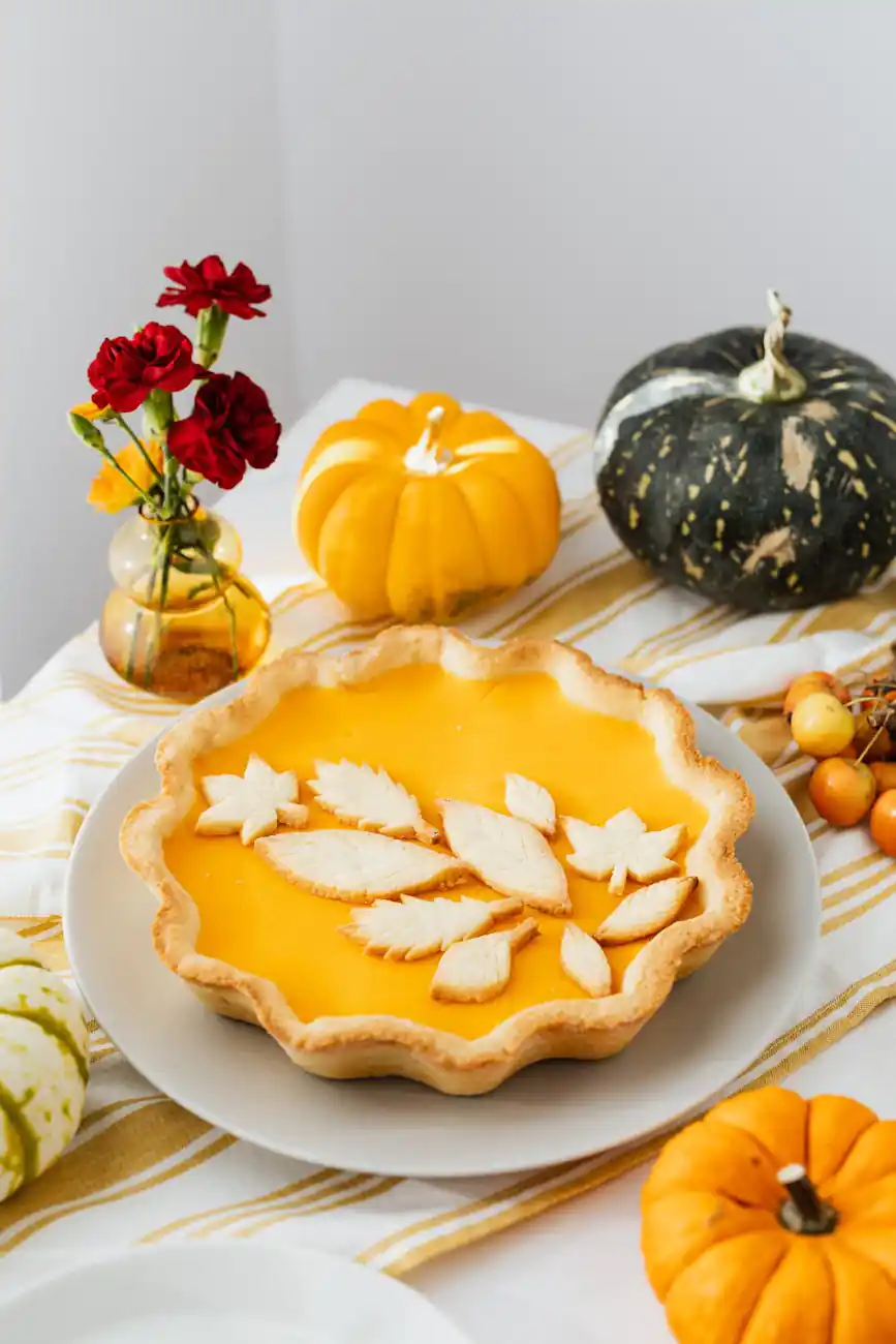 baked pumpkin pie on a ceramic plate