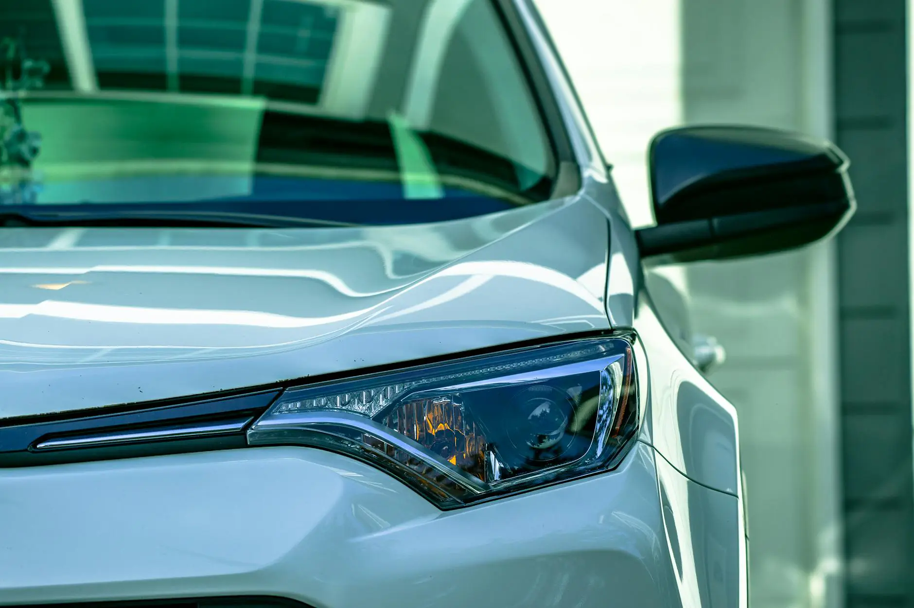 close up photography of car headlight