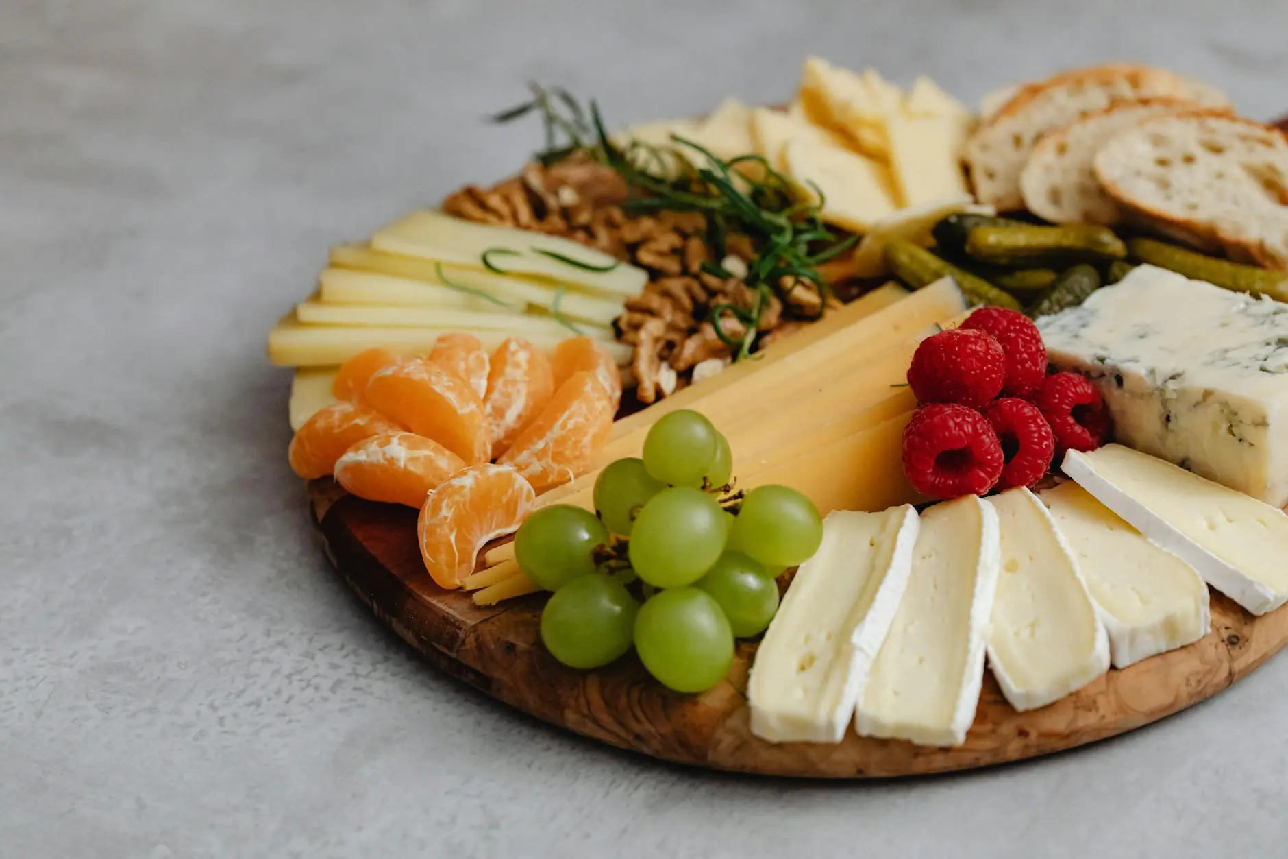 an assorted food on a charcuterie board