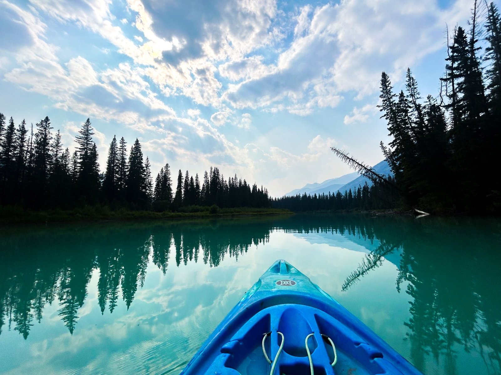 peaceful kayaking on pristine lake at sunset