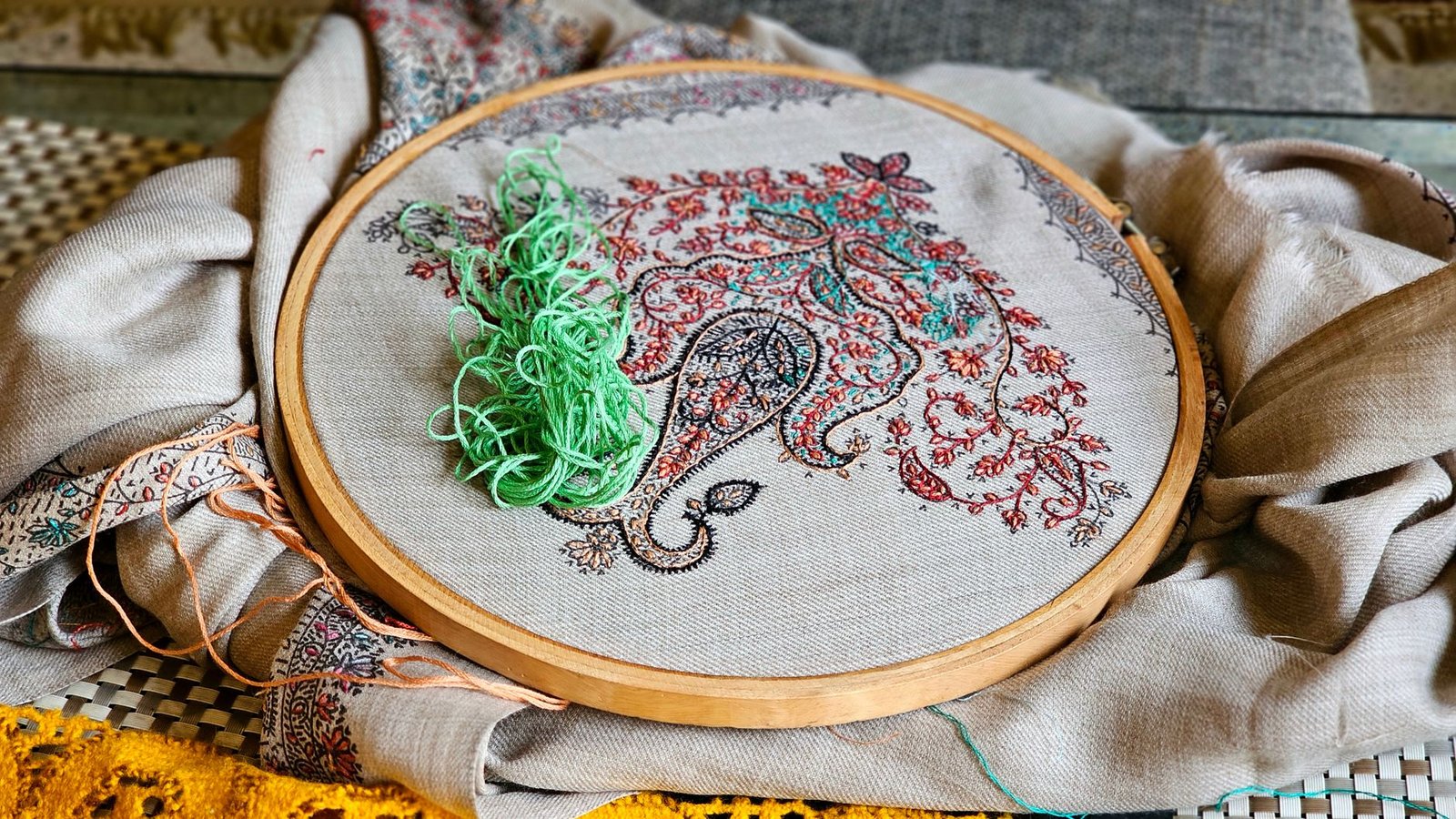 intricate embroidery hoop with thread and fabric