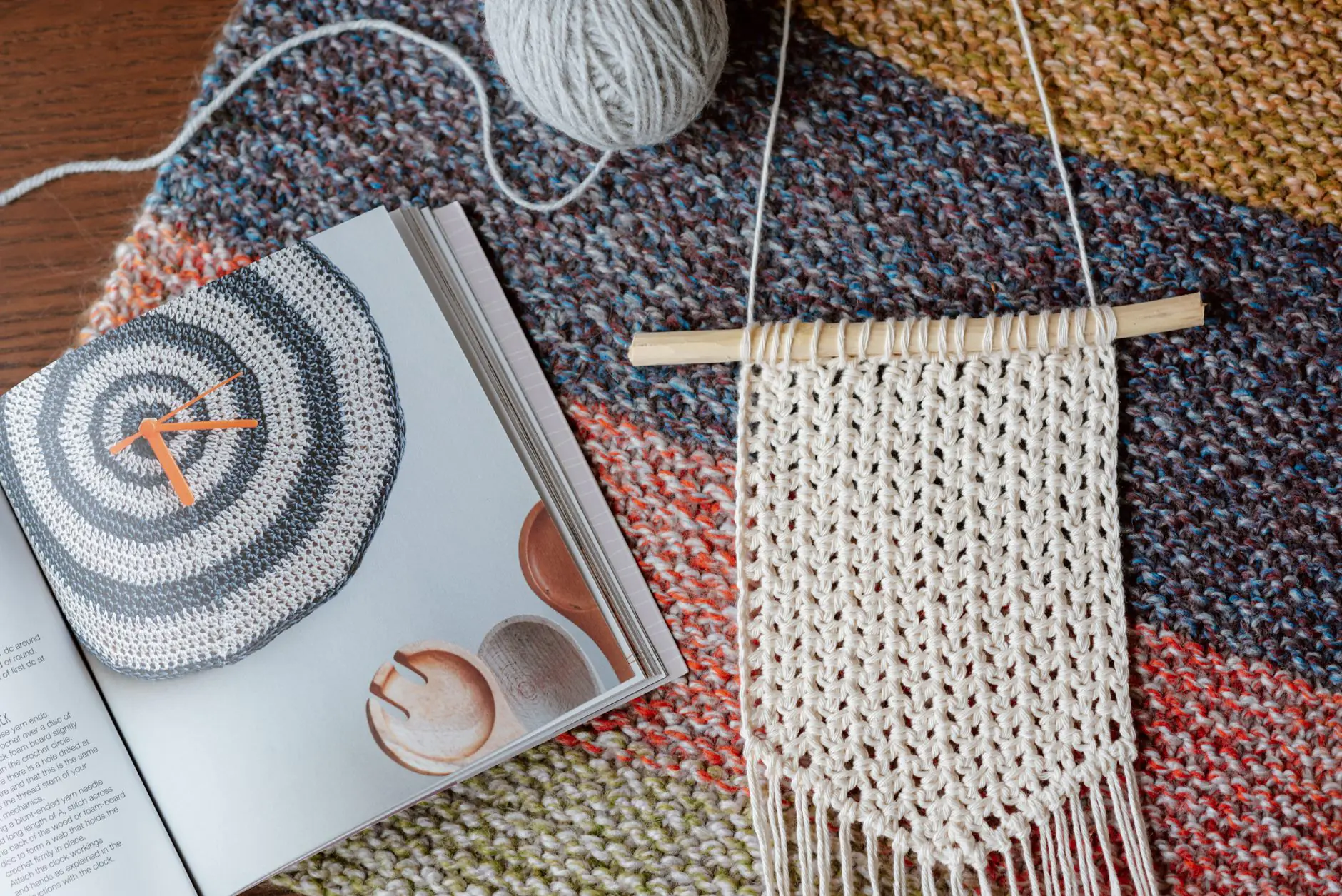 knitted piece near magazine with manual