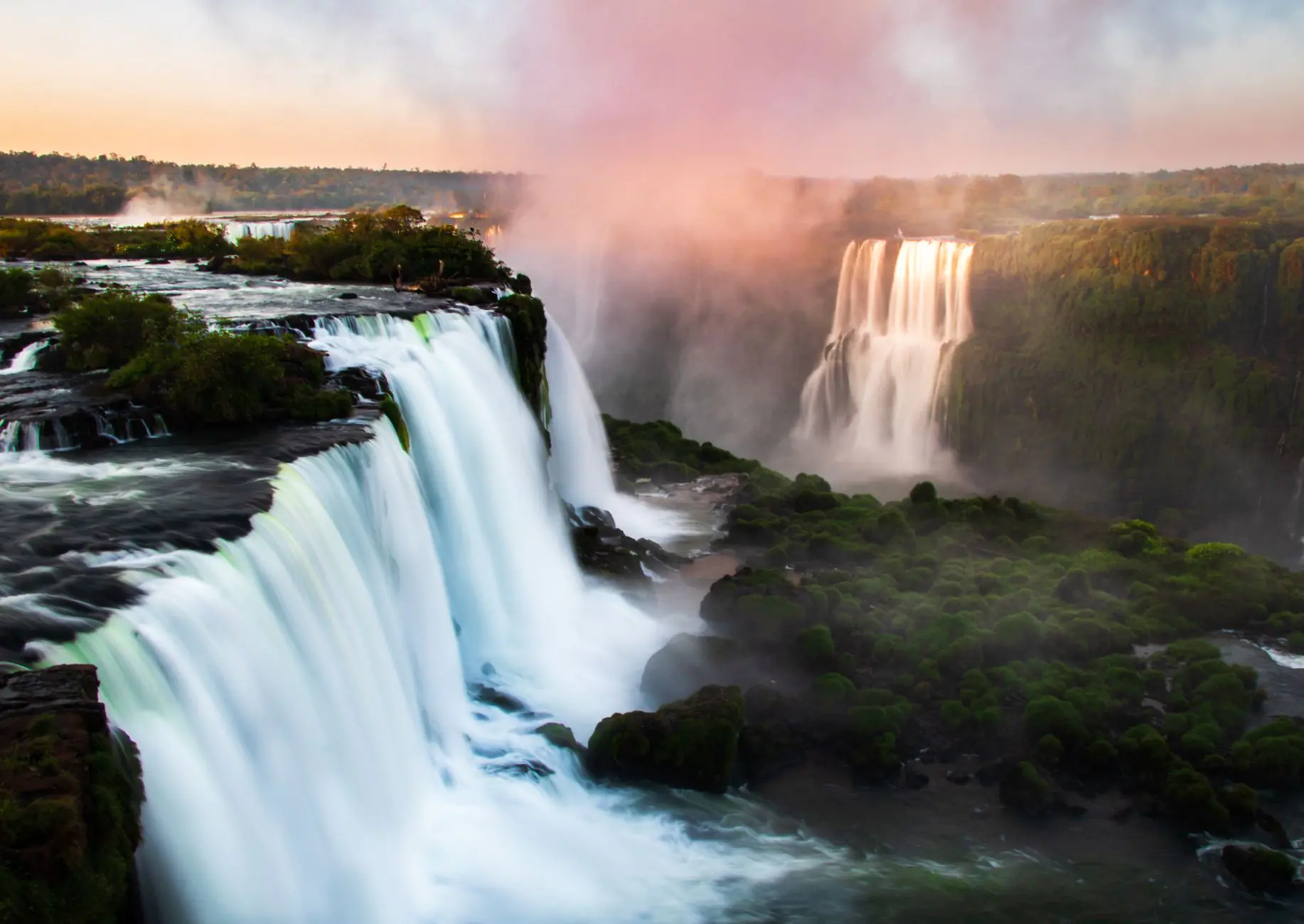 waterfalls under cloudy sky